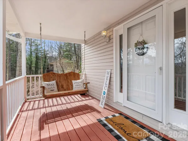 a view of a balcony with wooden floor
