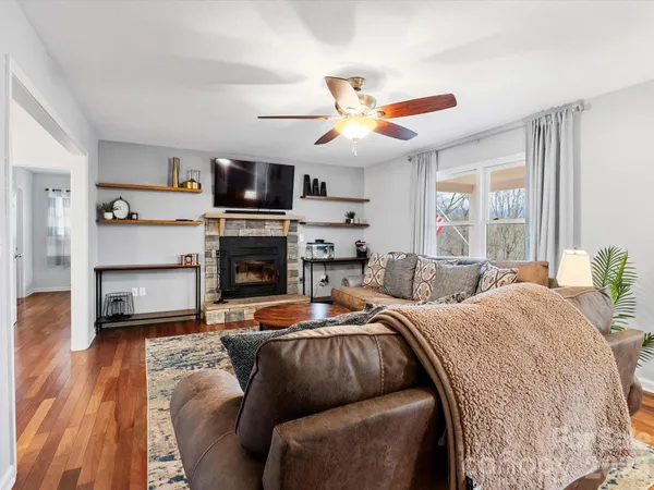 a bedroom with furniture and a fireplace