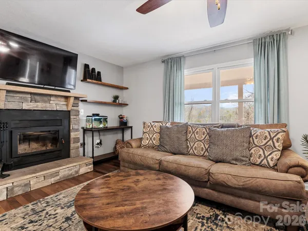 a living room with furniture and a fireplace