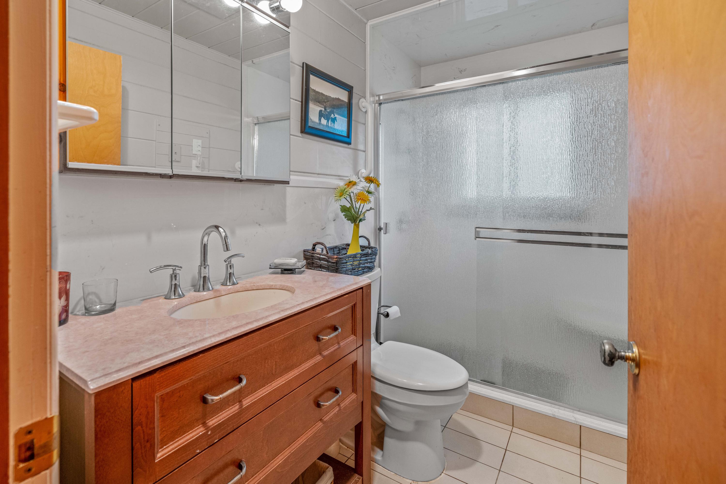 40 Lake Creek Lp Road Eagle Point, OR 97524 - Photo 30 of 70 a bathroom with a granite countertop sink toilet and shower