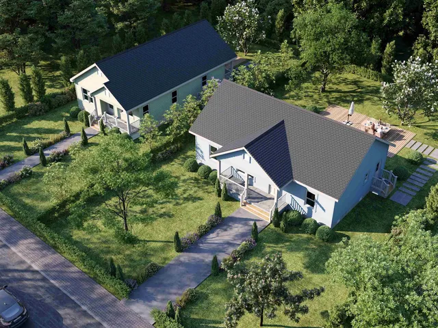 an aerial view of house with yard