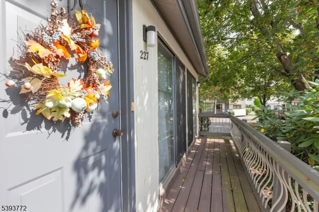 a view of balcony with wooden floor