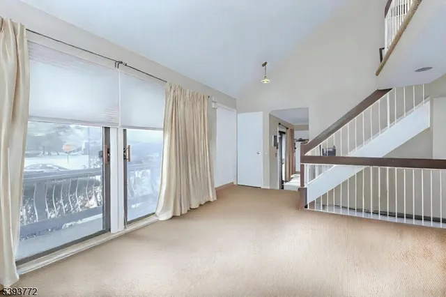 a view of a hallway with staircase