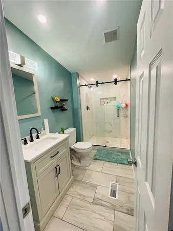 a bathroom with double vanity sink and a mirror