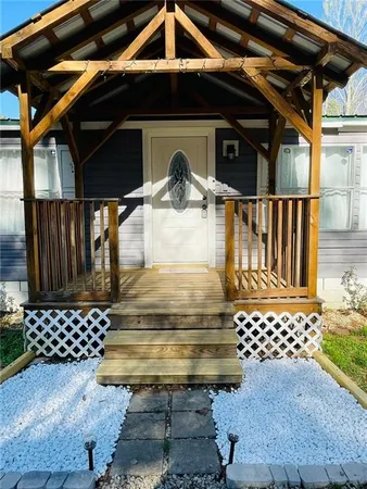 a view of porch with wooden floor