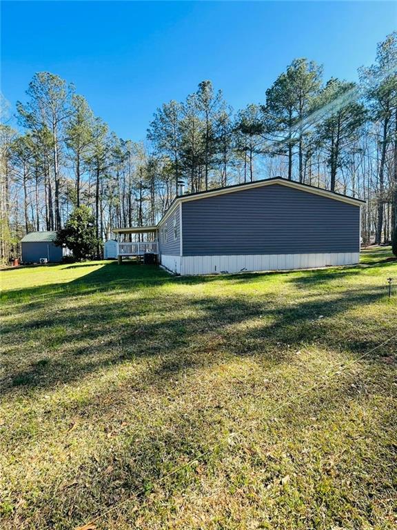489 Childers Road Colbert, GA 30628 - Photo 22 of 30 a view of swimming pool is middle in the garden