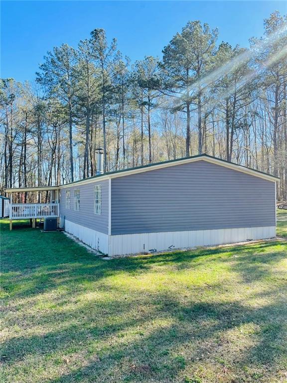 489 Childers Road Colbert, GA 30628 - Photo 23 of 30 a view of yard with swimming pool and trees in the background
