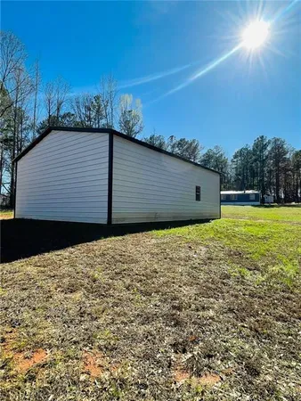 a backyard of a house with large trees