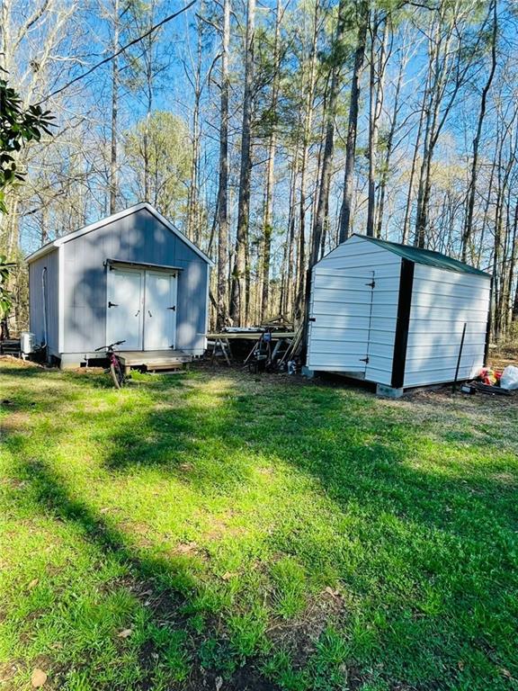 489 Childers Road Colbert, GA 30628 - Photo 29 of 30 a view of a backyard with potted plants and large tree