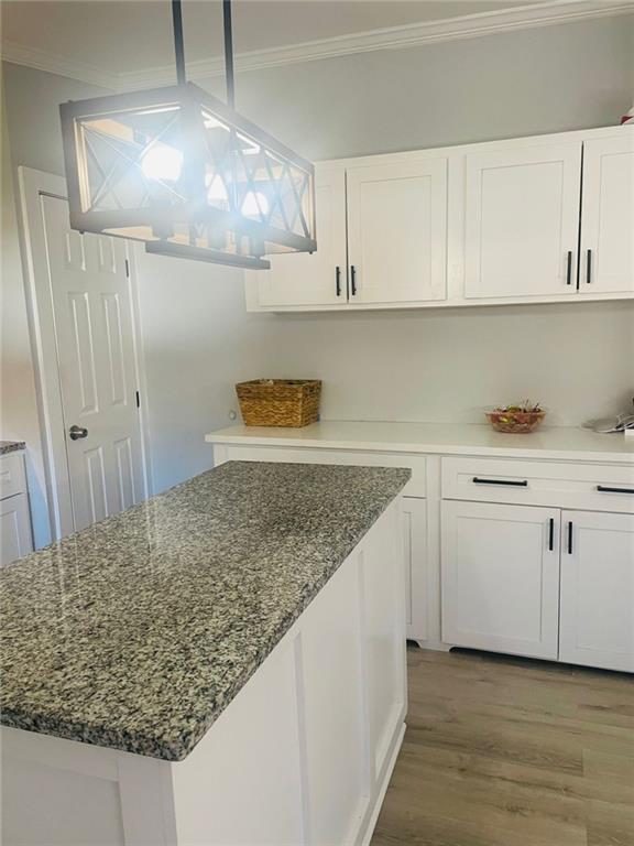 489 Childers Road Colbert, GA 30628 - Photo 7 of 30 a kitchen with white cabinets