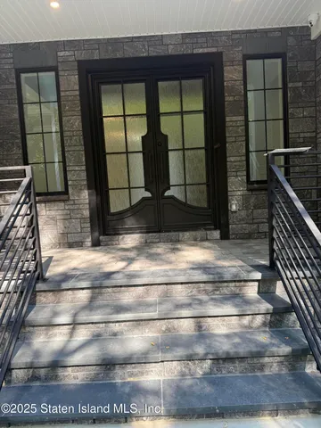 a kitchen with granite countertop white cabinets stainless steel appliances and sink