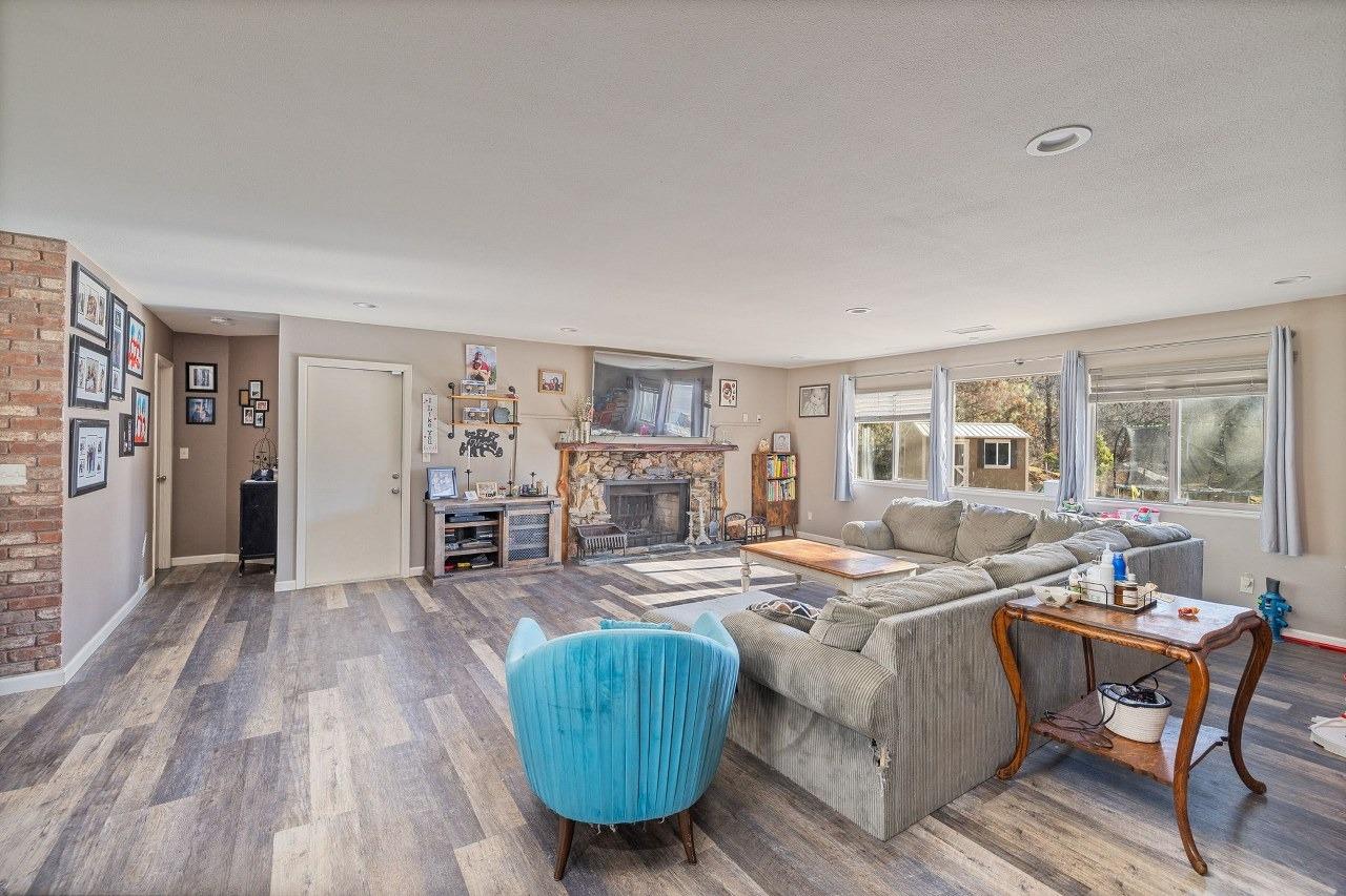 36820 Mudge Ranch Road Coarsegold, CA 93614 - Photo 11 of 75 a living room with furniture and wooden floor