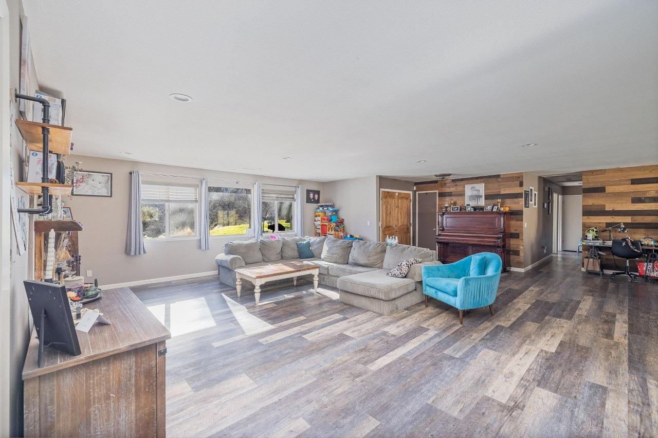 36820 Mudge Ranch Road Coarsegold, CA 93614 - Photo 13 of 75 a living room with furniture and a wooden floor