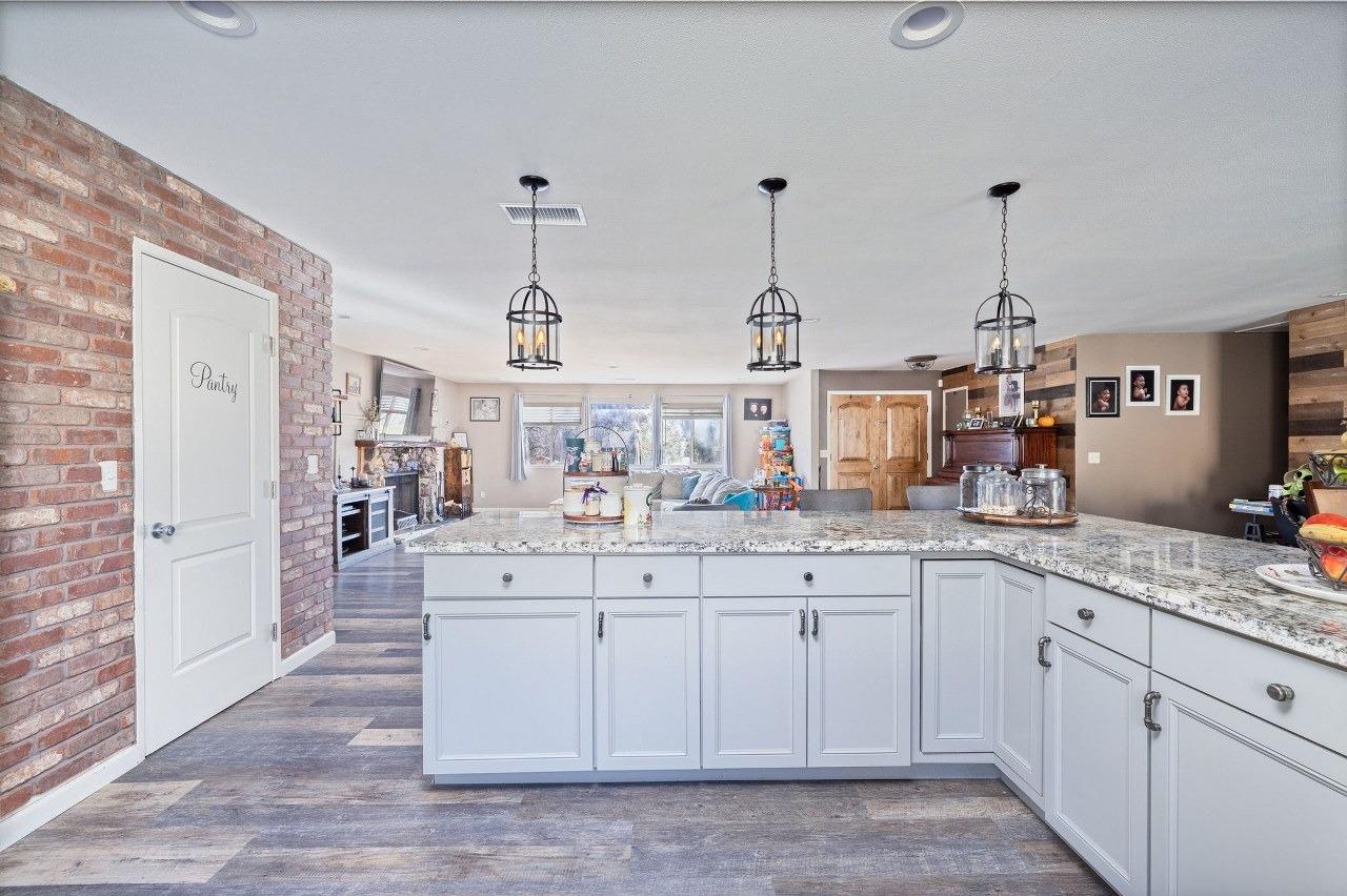 36820 Mudge Ranch Road Coarsegold, CA 93614 - Photo 21 of 75 a kitchen with sink and cabinets