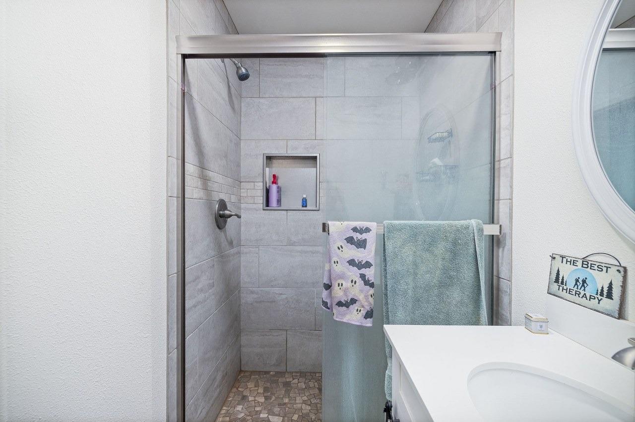 36820 Mudge Ranch Road Coarsegold, CA 93614 - Photo 46 of 75 a bedroom with a bed and a couch