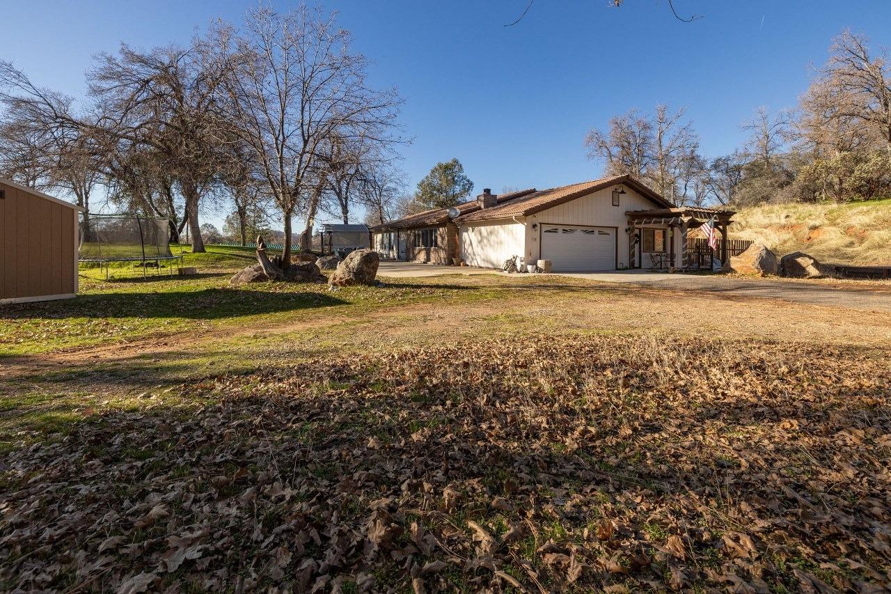 36820 Mudge Ranch Road Coarsegold, CA 93614 - Photo 49 of 75 a view of a house with a yard