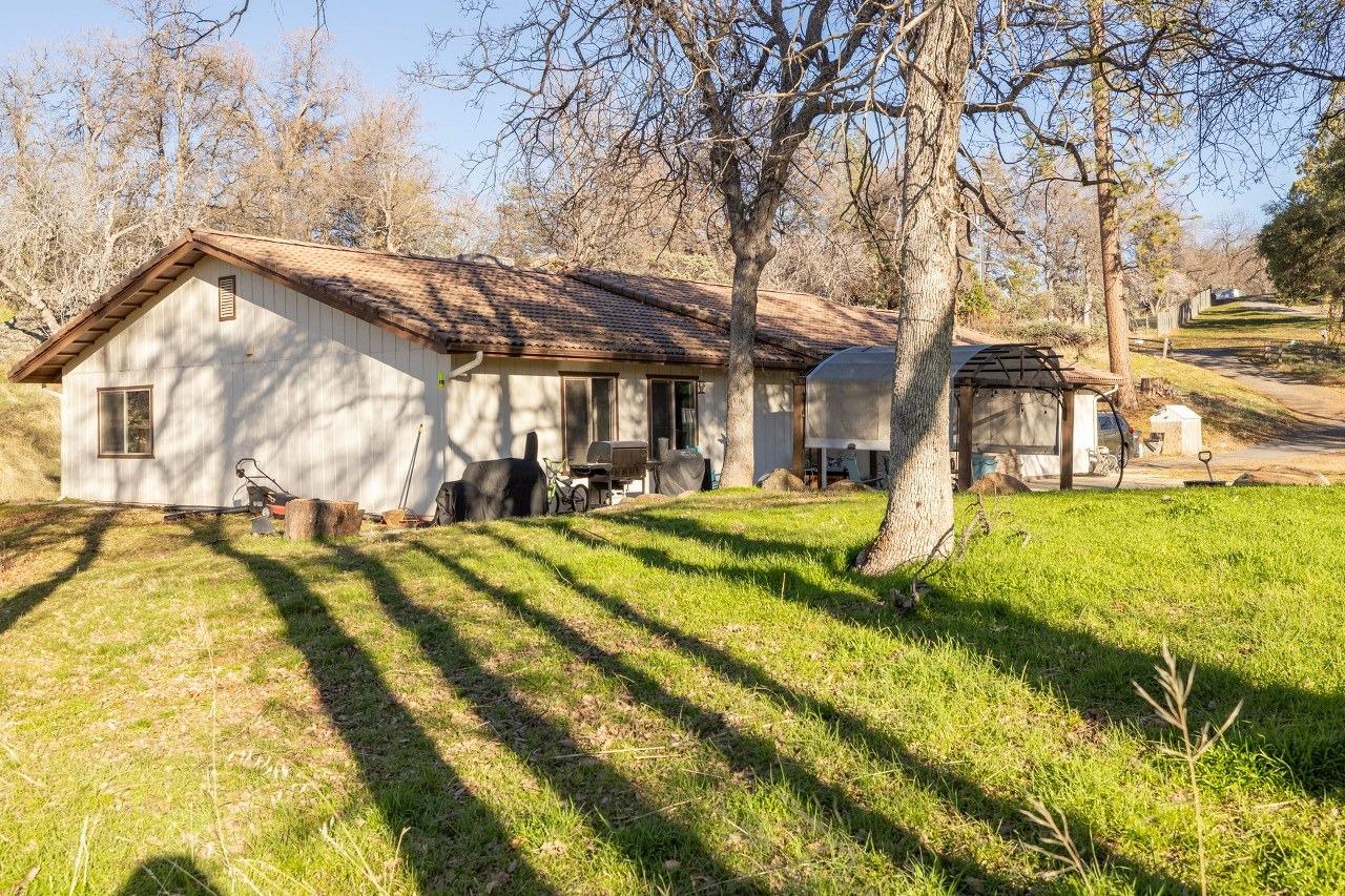 36820 Mudge Ranch Road Coarsegold, CA 93614 - Photo 57 of 75 a view of a swimming pool with a yard