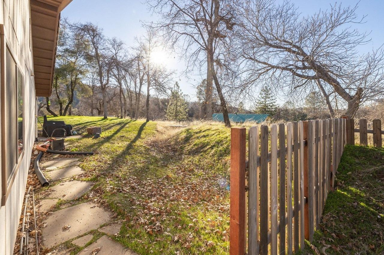 36820 Mudge Ranch Road Coarsegold, CA 93614 - Photo 59 of 75 a view of a backyard with wooden fence
