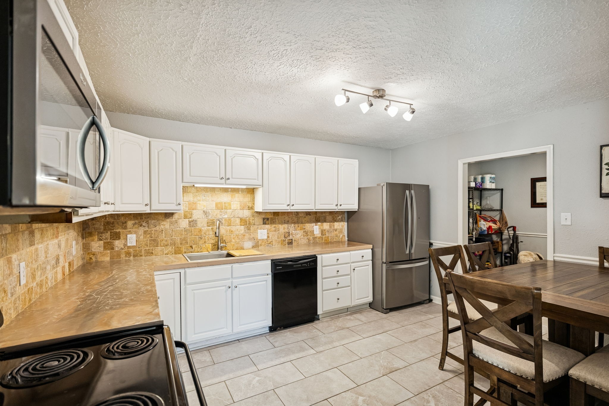 2370 Patton Hollow Road Watertown, TN 37184 - Photo 17 of 50 a kitchen with stainless steel appliances kitchen island granite countertop a sink and cabinets