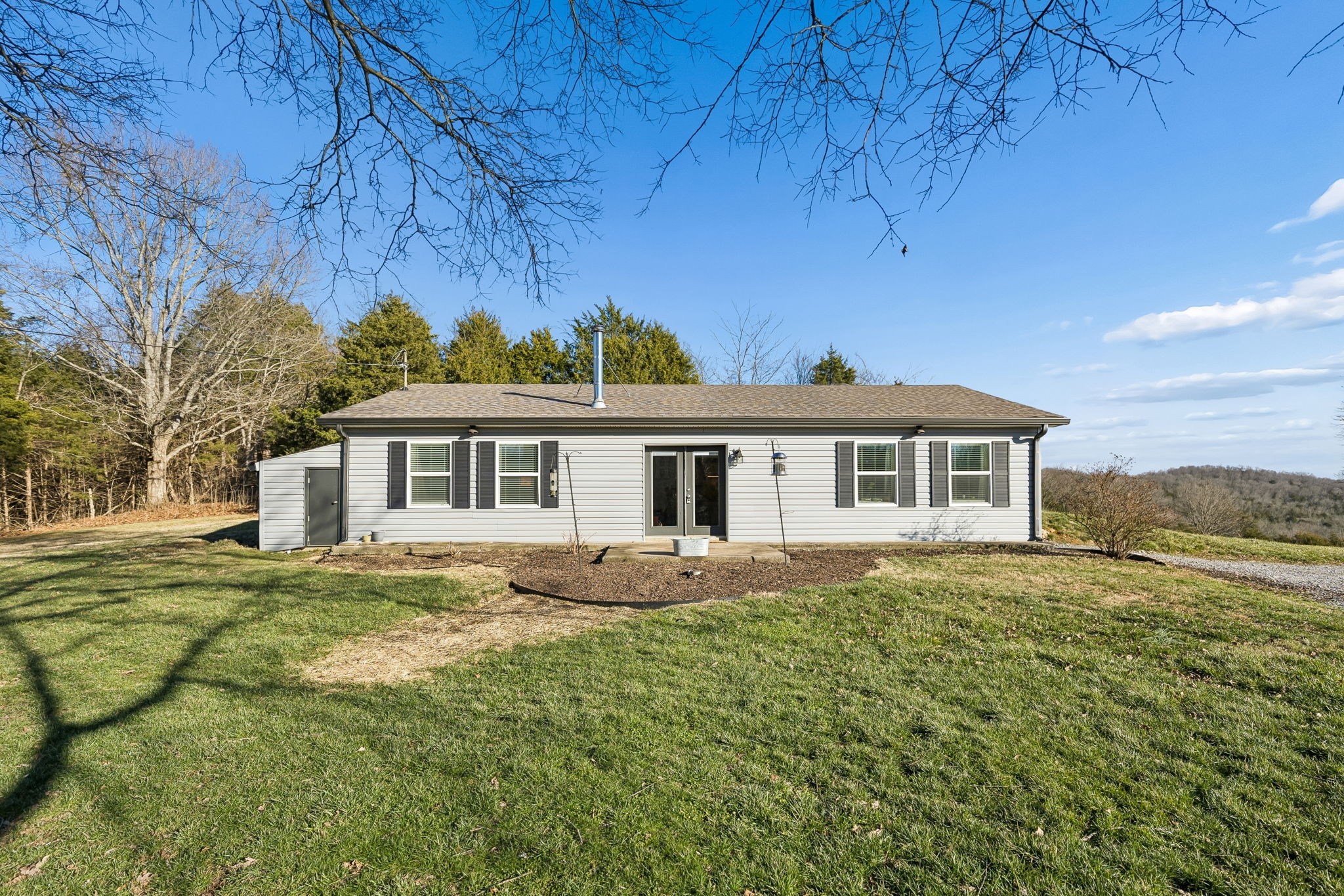 2370 Patton Hollow Road Watertown, TN 37184 - Photo 23 of 50 a front view of a house with a garden