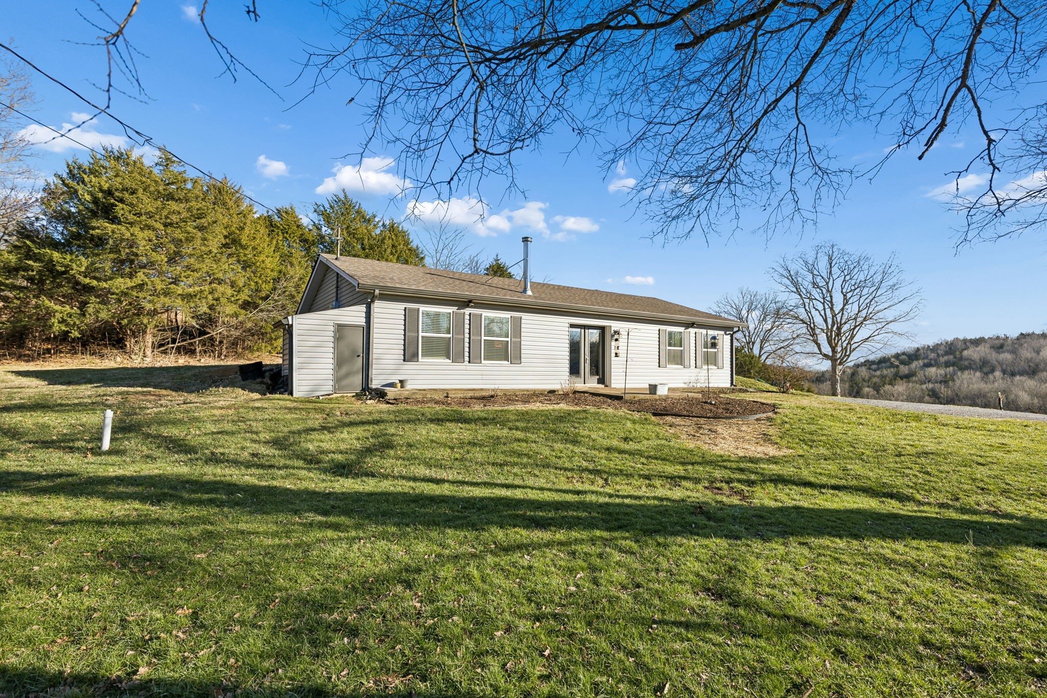 2370 Patton Hollow Road Watertown, TN 37184 - Photo 24 of 50 a front view of a house with a garden