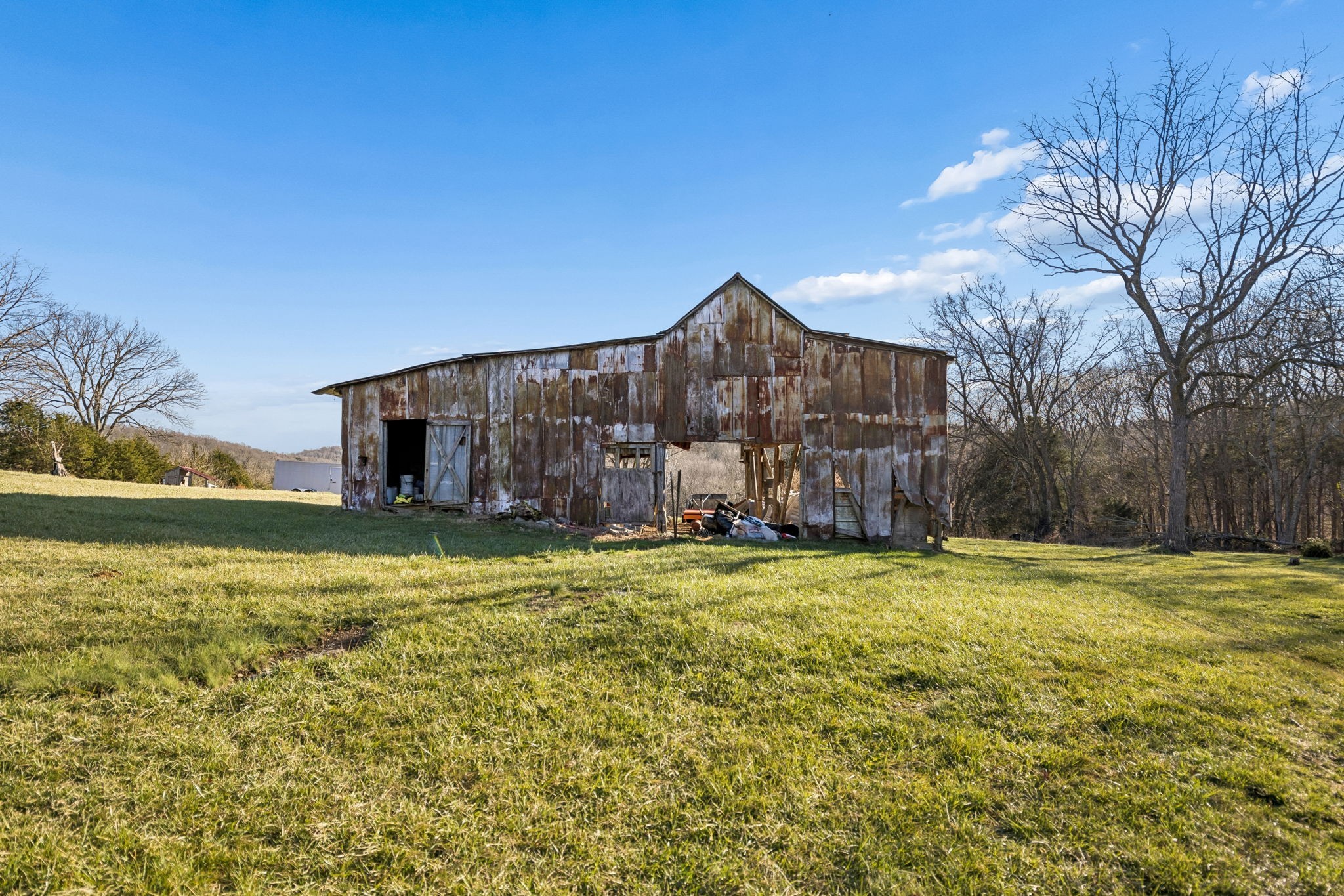 2370 Patton Hollow Road Watertown, TN 37184 - Photo 33 of 50 a big house with a big yard and large trees