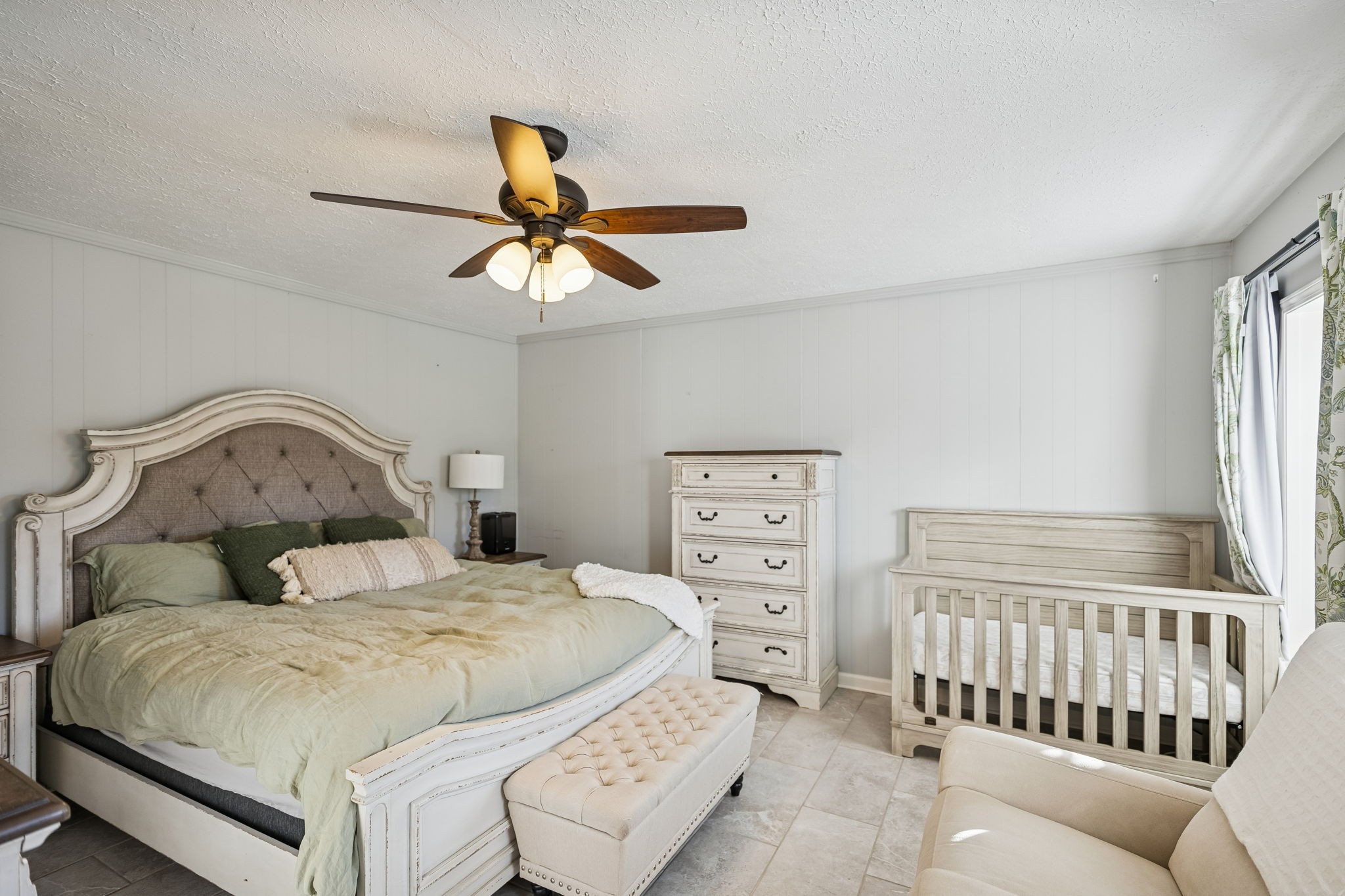 2370 Patton Hollow Road Watertown, TN 37184 - Photo 5 of 50 a bedroom with a bed a chandelier and dresser
