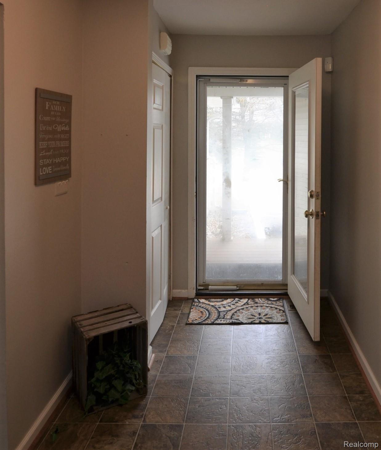 750 East Davis Road Howell, MI 48843 - Photo 21 of 21 WARM & WELCOMING ENTRY FOYER AREA LEADS TO OPEN FLOOR PLAN