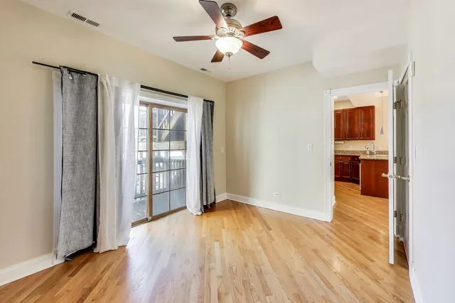 a view of livingroom with hardwood floor and a ceiling fan