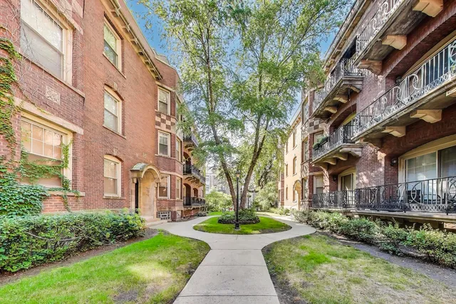 a view of a building with a yard