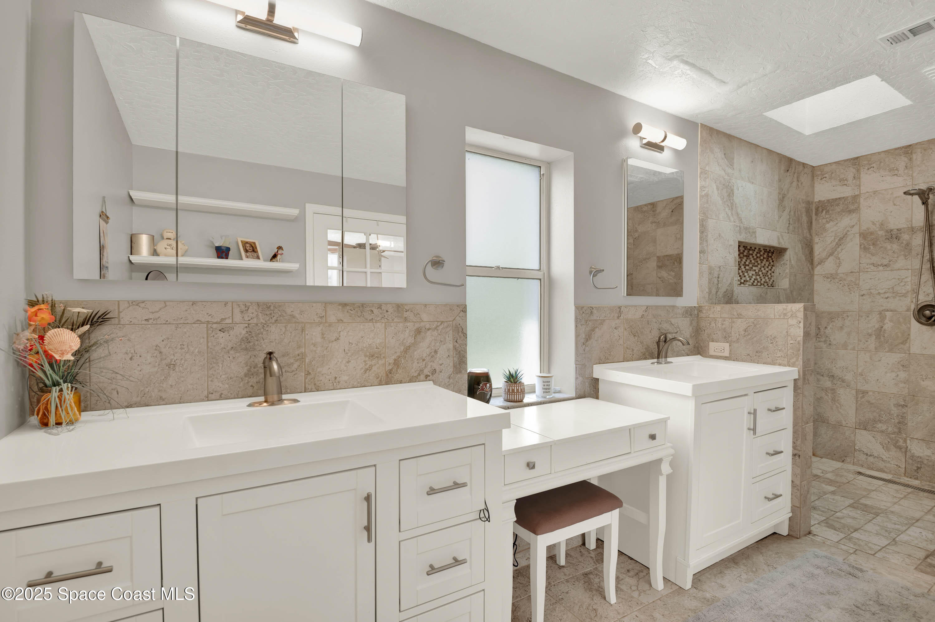 930 Miller Lane Melbourne, FL 32934 - Photo 17 of 40 a bathroom with a sink and a mirror