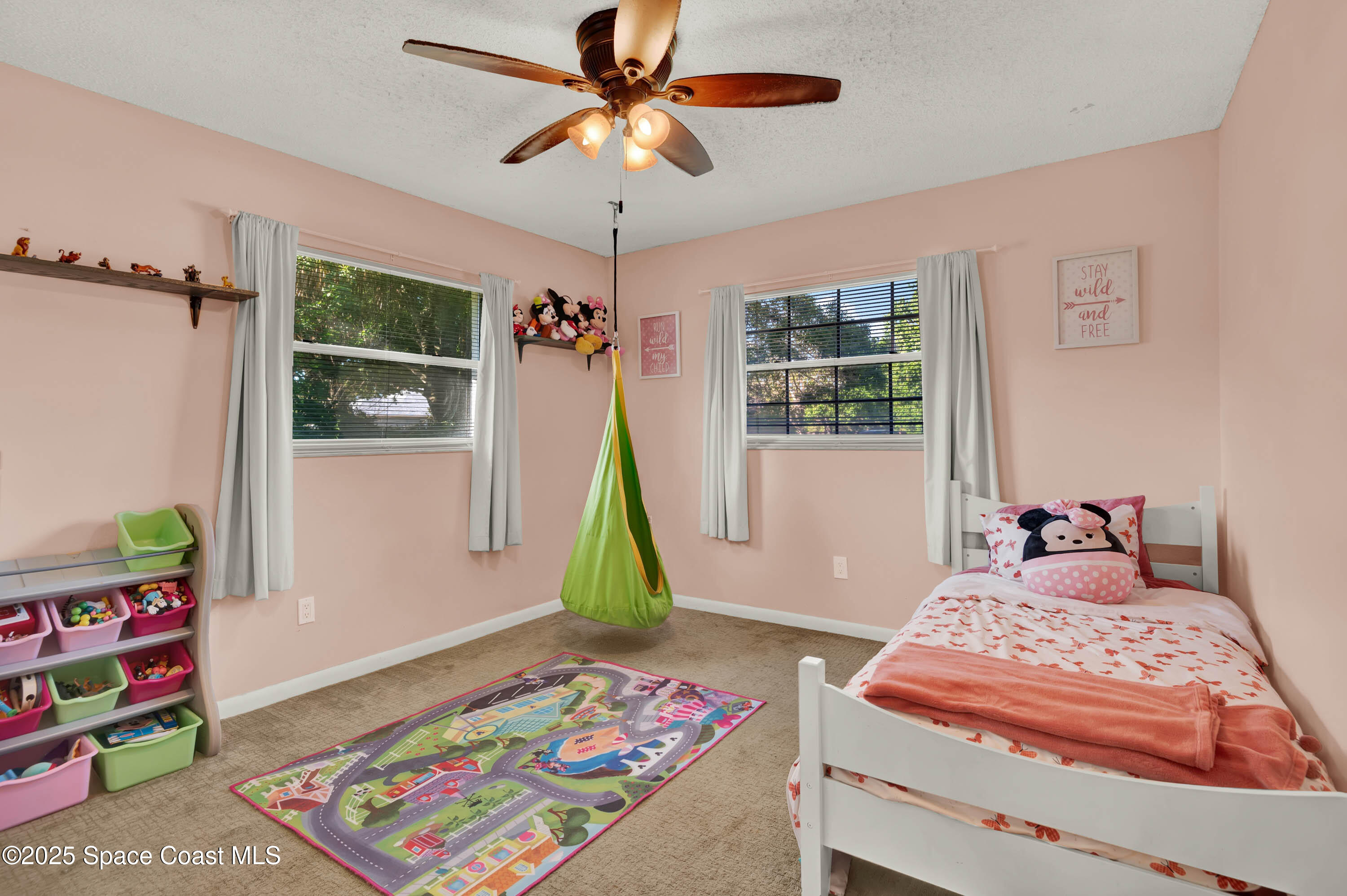 930 Miller Lane Melbourne, FL 32934 - Photo 21 of 40 a bedroom with bed and a window