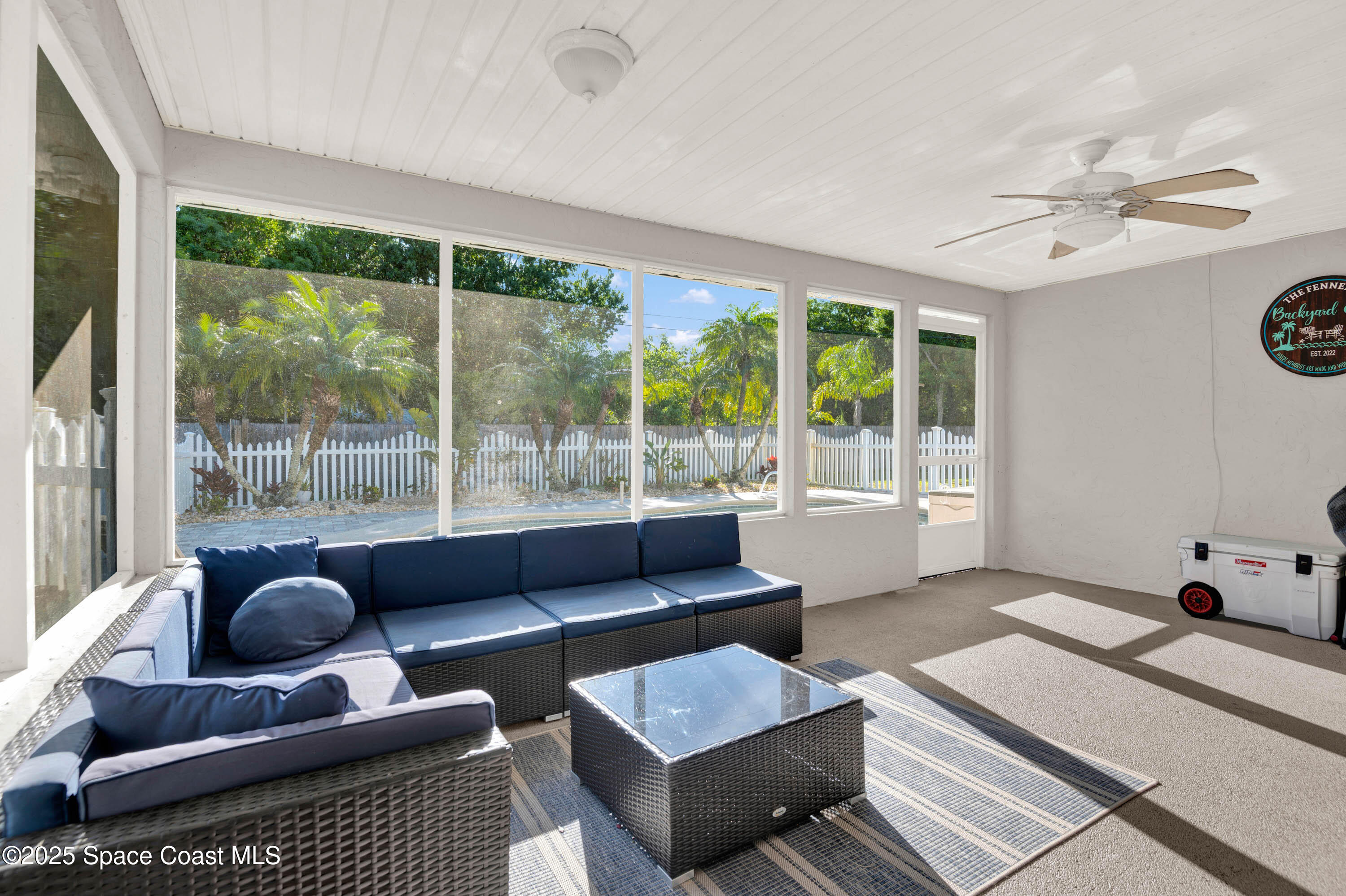 930 Miller Lane Melbourne, FL 32934 - Photo 26 of 40 a living room with furniture and a large window