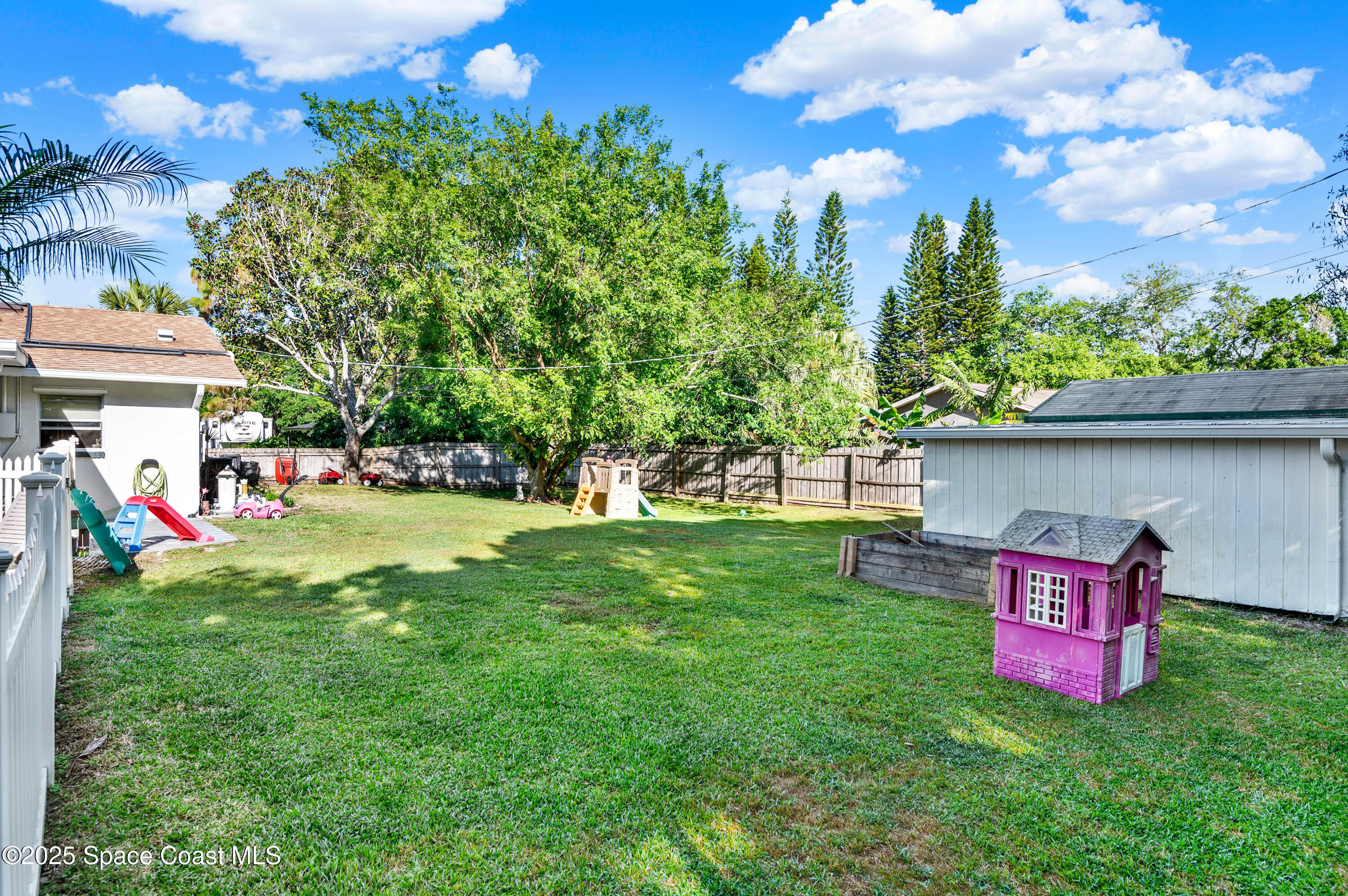 930 Miller Lane Melbourne, FL 32934 - Photo 30 of 40 a view of a tree with a yard