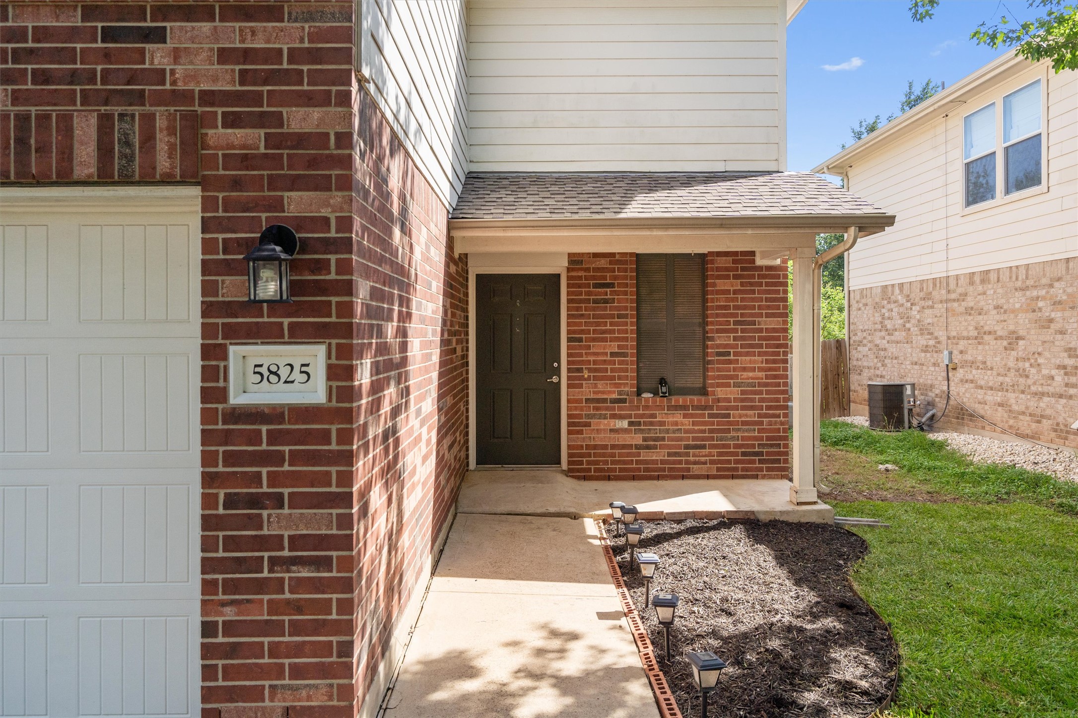 5825 Silver Screen Drive Austin, TX 78747 - Photo 5 of 40 A classic brick exterior offers enduring appeal with an inviting front entry and neat landscaping.
