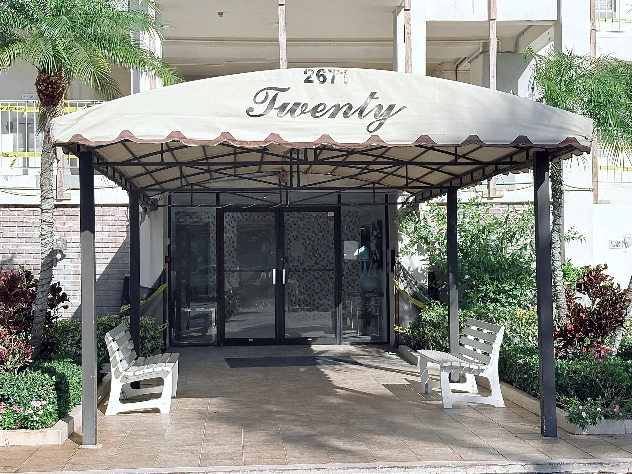 2671 South Course Drive, Unit 108 Pompano Beach, FL 33069 - Photo 39 of 40 a sign on the side of a building