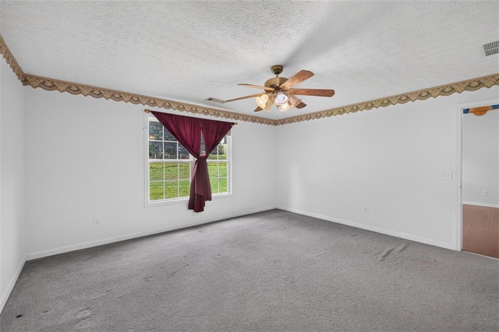 602 Pendergrass Road Winder, GA 30680 - Photo 22 of 44 a view of an empty room with a window