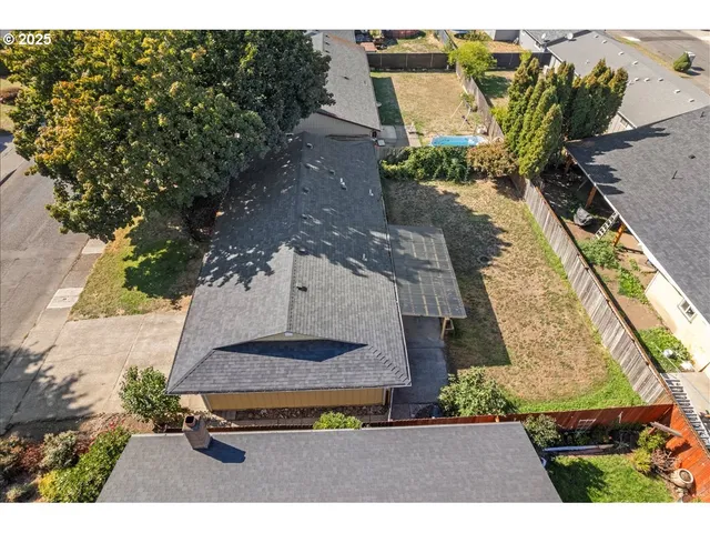 an aerial view of house with a yard