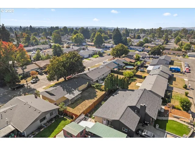 an aerial view of a city with lots of residential buildings