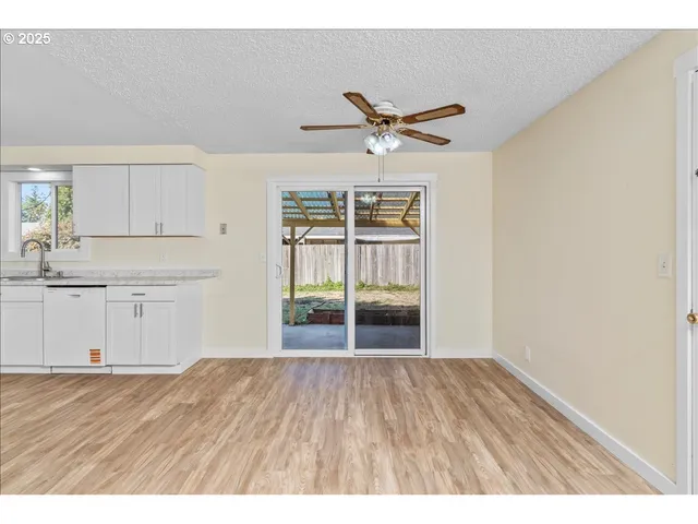 a view of a kitchen with wooden floor