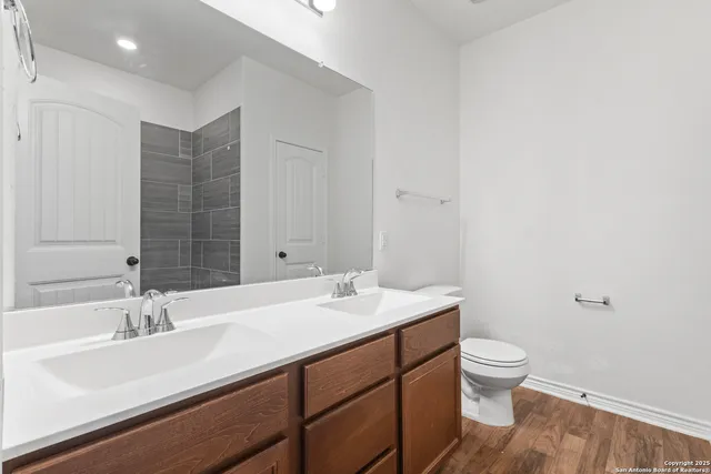 a bathroom with a sink toilet and vanity