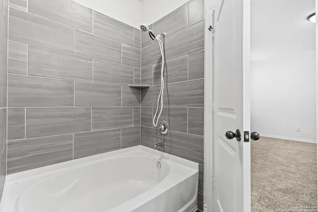 a bathroom with a bathtub