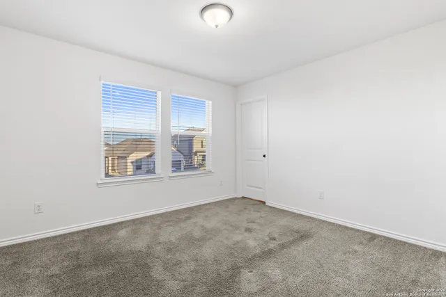 an empty room with a bathroom