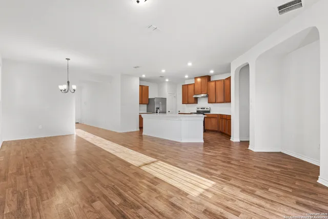 a view of kitchen and kitchen with wooden floor