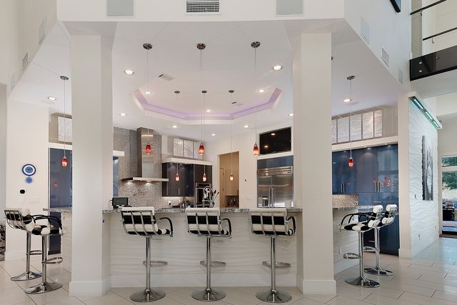 a large kitchen with lots of furniture