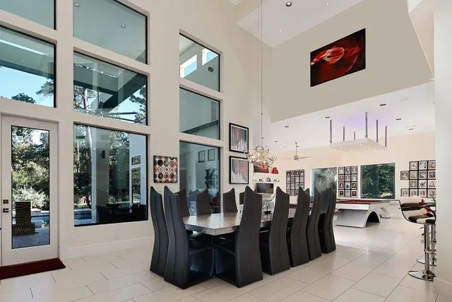 a dining room with furniture and window