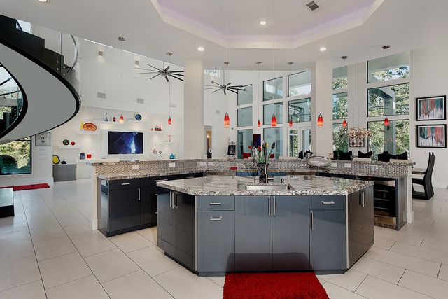 a kitchen with cabinets and window