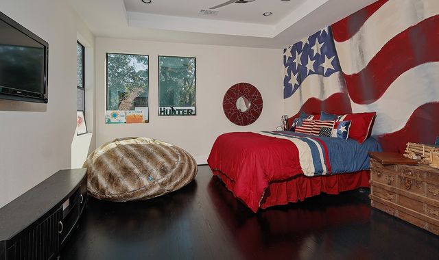 a bedroom with a bed and a television