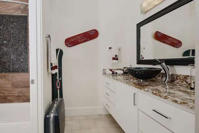 a kitchen with a refrigerator and a stove
