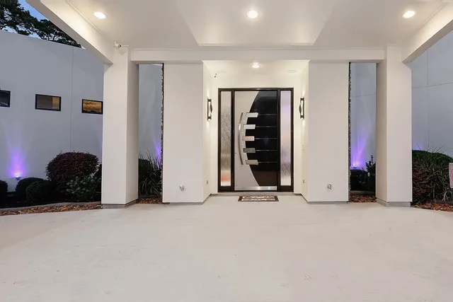 an empty room with closet and a large window